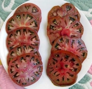 An extremely unusual and exotic guest in your garden - the Negritenok tomato: we grow it ourselves and enjoy the harvest