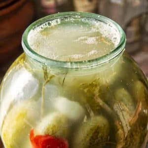 Why does a white coating appear on pickled cucumbers and is it possible to eat them?