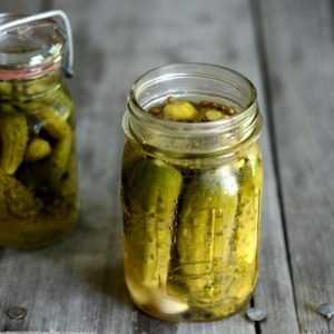 Why does a white coating appear on pickled cucumbers and is it possible to eat them?