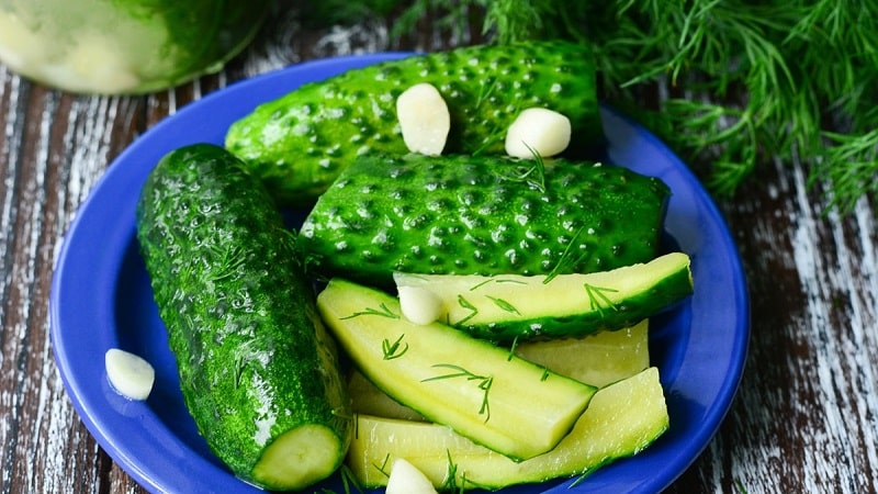 Classic recipe for lightly salted cucumbers in a pan with hot brine