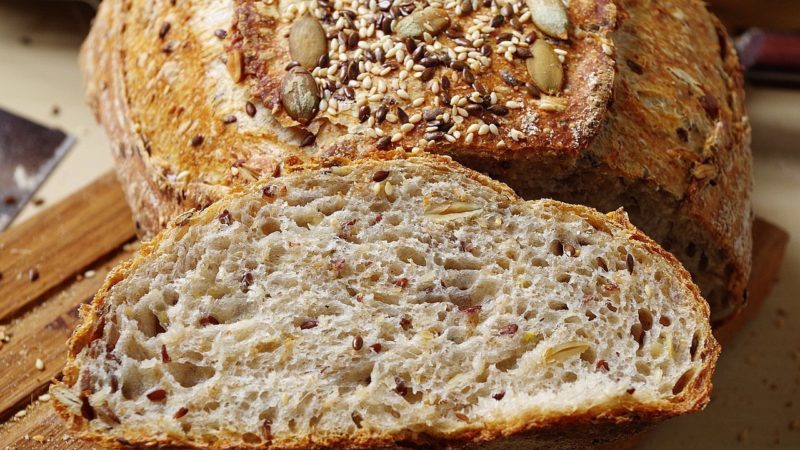 How is flour made from whole grain wheat and where is it used?