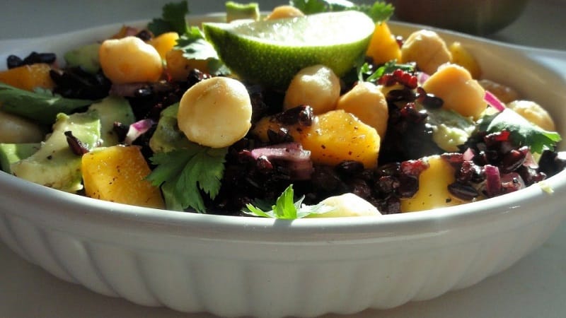 Where and how does macadamia nut grow and how is it used?