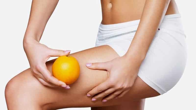 Woman and oranges - benefits and harms
