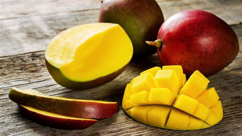 What is the calorie content of mango and what are its benefits and harms?