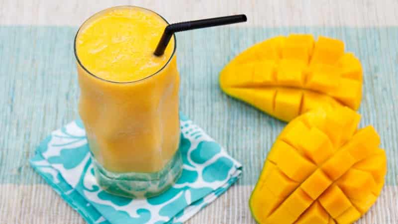 What is the calorie content of mango and what are its benefits and harms?