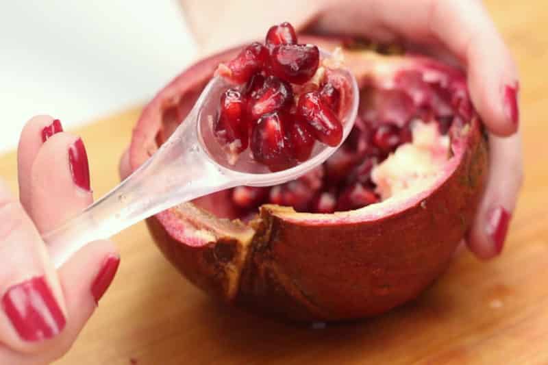 What are the benefits of pomegranate with seeds and how many calories does it contain?